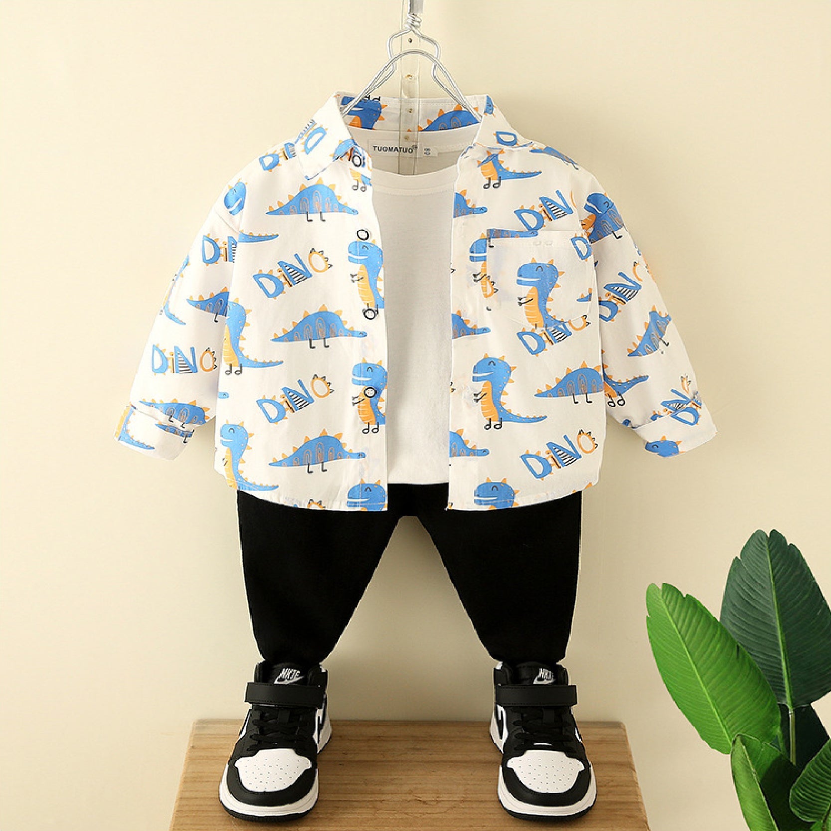 Dino Explorer Chic: Pure Cotton Dinosaur Printed Shirt and Black Trouser Set with Imaginative Pocket Fun for Kids!